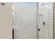 Tiled shower with a glass door and window, showcasing modern design at 12176 E Chevelon Trl, Gold Canyon, AZ 85118
