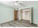 Bedroom features wood-look floors, open closet and ceiling fan at 12811 N 44Th Dr, Glendale, AZ 85304