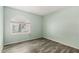 Bright bedroom featuring wood-look flooring and a window with an arched top at 12811 N 44Th Dr, Glendale, AZ 85304