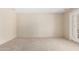 Neutral bedroom featuring a light carpet, ceiling fan, and an exterior exit at 12811 N 44Th Dr, Glendale, AZ 85304