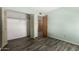 A bedroom featuring a closet and wood look floors at 12811 N 44Th Dr, Glendale, AZ 85304