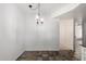 Open dining area featuring a hanging light fixture with easy access to other rooms at 12811 N 44Th Dr, Glendale, AZ 85304