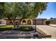 Charming single-story home featuring a well-manicured lawn and inviting curb appeal at 12811 N 44Th Dr, Glendale, AZ 85304