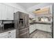 Bright kitchen features stainless steel appliances, tile backsplash, granite counters and tile floor at 12811 N 44Th Dr, Glendale, AZ 85304