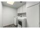 Bright laundry room with cabinets and modern washer and dryer at 12811 N 44Th Dr, Glendale, AZ 85304
