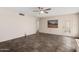 Bright living room with tile floors and a ceiling fan, offering a comfortable living space at 12811 N 44Th Dr, Glendale, AZ 85304