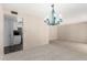 Open living area with overhead lighting with access to a kitchen area at 12811 N 44Th Dr, Glendale, AZ 85304