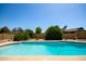 Refreshing backyard pool features serene landscaping, hardscape patio, and a tranquil setting for outdoor enjoyment at 12811 N 44Th Dr, Glendale, AZ 85304