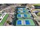 Aerial view of pickleball courts with green and blue surfaces surrounded by desert landscaping at 17179 S 174Th S Dr, Goodyear, AZ 85338