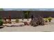 Desert landscape with decorative cactus plants, rocks, and gravel, creating a serene outdoor space at 17179 S 174Th S Dr, Goodyear, AZ 85338