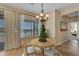 Charming dining area features a cozy round table set next to sunlit windows, creating a warm and inviting atmosphere at 17179 S 174Th S Dr, Goodyear, AZ 85338