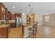 Kitchen island with granite countertops, stainless steel appliances, and hardwood cabinetry at 17179 S 174Th S Dr, Goodyear, AZ 85338