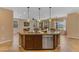 Open-concept kitchen with a granite-topped island and a seamless connection to the dining and living areas at 17179 S 174Th S Dr, Goodyear, AZ 85338