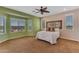 Cozy main bedroom featuring large windows and an accent wall, providing bright natural light at 17179 S 174Th S Dr, Goodyear, AZ 85338