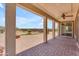 Covered patio area with paver flooring and outdoor kitchen, perfect for entertaining guests at 17179 S 174Th S Dr, Goodyear, AZ 85338