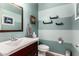 Stylish bathroom with a vanity, toilet, and decor at 17363 W Lisbon Ln, Surprise, AZ 85388