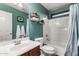Bathroom features a single sink vanity, toilet, and tub with shower at 17363 W Lisbon Ln, Surprise, AZ 85388