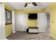 Bedroom with yellow walls, carpet flooring, ceiling fan and closet at 17363 W Lisbon Ln, Surprise, AZ 85388
