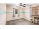 Cozy bedroom features neutral walls, carpet flooring, and a ceiling fan at 17363 W Lisbon Ln, Surprise, AZ 85388