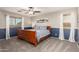 Cozy bedroom featuring plush carpeting, neutral paint and a view from the window at 17363 W Lisbon Ln, Surprise, AZ 85388