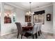 Well-appointed dining room with a chandelier, rug, and comfortable seating at 17363 W Lisbon Ln, Surprise, AZ 85388
