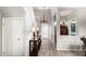 Bright foyer with wood floors, staircase, chandelier, and decor at 17363 W Lisbon Ln, Surprise, AZ 85388
