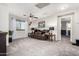 Inviting living room with plush carpeting, a ceiling fan and a window at 17363 W Lisbon Ln, Surprise, AZ 85388