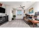 Inviting living room featuring plush carpeting, a ceiling fan and a window at 17363 W Lisbon Ln, Surprise, AZ 85388
