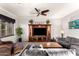 Comfortable living room features a large entertainment center and cozy seating at 17363 W Lisbon Ln, Surprise, AZ 85388