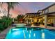 Gorgeous backyard with a sparkling pool, hot tub, and covered patio for relaxing evenings at 17363 W Lisbon Ln, Surprise, AZ 85388