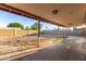 The backyard features a covered patio and gravel landscaping at 1751 W Carol Ave, Mesa, AZ 85202