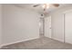 Bedroom with neutral color scheme, carpet, ceiling fan and closet at 1751 W Carol Ave, Mesa, AZ 85202