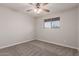 This bedroom offers carpet and a window for natural light at 1751 W Carol Ave, Mesa, AZ 85202