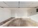 A two car garage with concrete floor and white walls at 1751 W Carol Ave, Mesa, AZ 85202