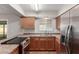 This bright kitchen offers stainless steel appliances and ample countertop space at 1751 W Carol Ave, Mesa, AZ 85202