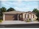 Charming single-story home with a two-car garage and stone accents, complemented by a well-manicured lawn and desert landscaping at 17721 W Ford St, Goodyear, AZ 85338