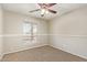Bright bedroom featuring a large window providing natural light and neutral colored walls at 18402 N 17Th Ave, Phoenix, AZ 85023
