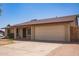 Single-story home with a two-car garage and minimal landscaping at 18402 N 17Th Ave, Phoenix, AZ 85023
