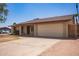 Single-story home with a two-car garage and minimal landscaping at 18402 N 17Th Ave, Phoenix, AZ 85023