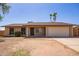 Charming single-story home features a two-car garage and low-maintenance front yard at 18402 N 17Th Ave, Phoenix, AZ 85023