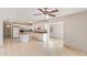 Bright kitchen features white cabinets, tile countertops, and an island, providing a functional and stylish space at 18402 N 17Th Ave, Phoenix, AZ 85023