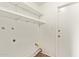 Laundry room with white shelving units and tile flooring at 18402 N 17Th Ave, Phoenix, AZ 85023