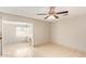 Bright living room features tile floors, a ceiling fan, and an adjoined sitting room at 18402 N 17Th Ave, Phoenix, AZ 85023