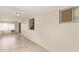 Living room with tile floors, neutral walls, and multiple windows at 18402 N 17Th Ave, Phoenix, AZ 85023