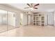 Bright living room with recessed shelving and sliding door access offers natural light and pool views at 18402 N 17Th Ave, Phoenix, AZ 85023