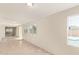 Enclosed sun room area with multiple windows and tile flooring, adjacent to the pool area at 18402 N 17Th Ave, Phoenix, AZ 85023