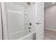 Modern bathroom featuring a bathtub with tile surround and a shower head at 18808 W Solano Dr, Litchfield Park, AZ 85340