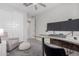 Bedroom with a desk, monitors, comfy chair, and carpet flooring at 18808 W Solano Dr, Litchfield Park, AZ 85340