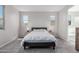 Cozy bedroom with plush carpeting, natural light, and neutral décor at 18808 W Solano Dr, Litchfield Park, AZ 85340