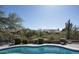 Inviting backyard featuring a pool and view of the desert at 18873 N 94Th Way, Scottsdale, AZ 85255